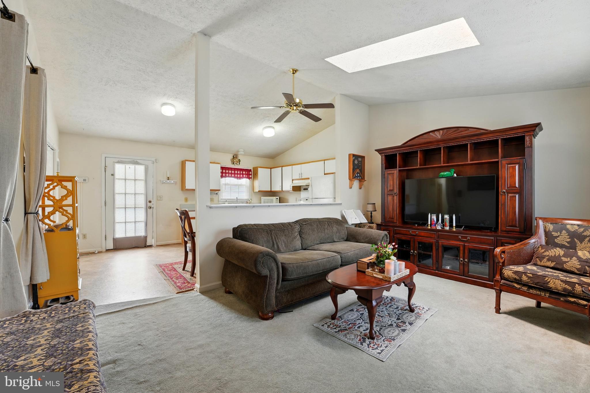 6775 Rugby Place Bealeton, VA 22712 - Photo 9 of 43 a living room with furniture and a flat screen tv