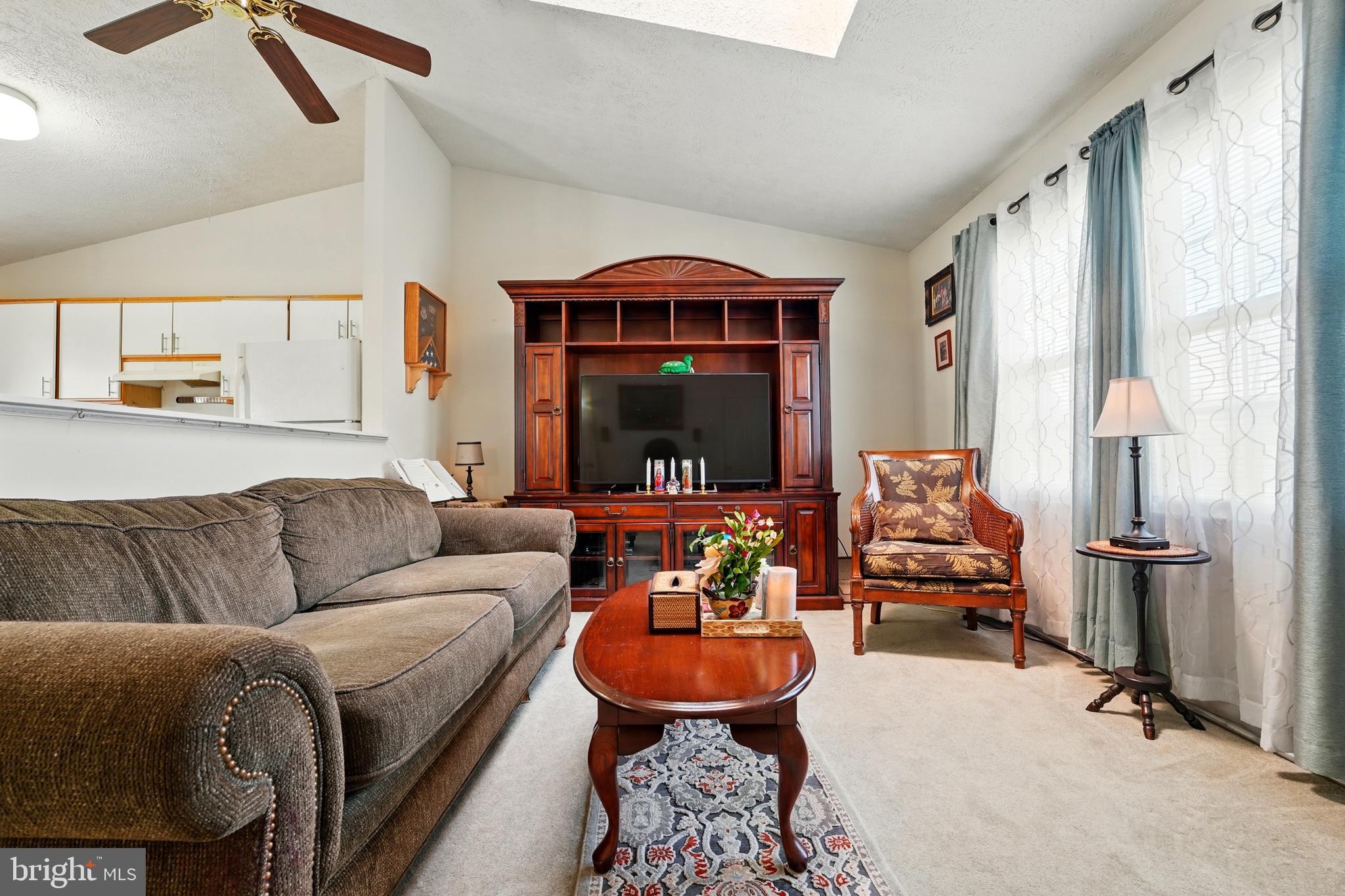 6775 Rugby Place Bealeton, VA 22712 - Photo 10 of 43 a living room with furniture and a flat screen tv