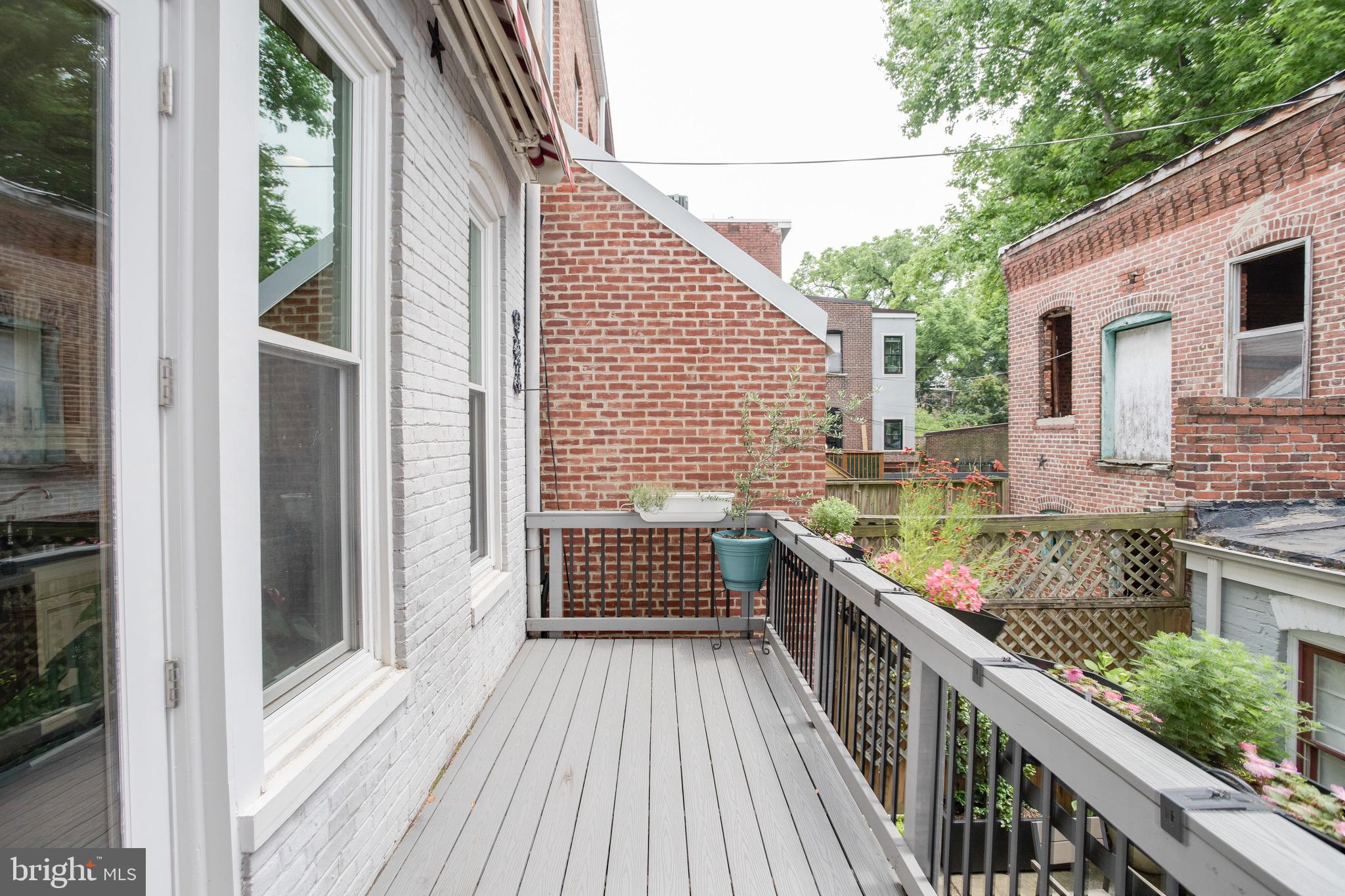 711 Massachusetts Avenue Northeast Washington, DC 20002 - Photo 23 of 68 Deck off the bright & airy kitchen