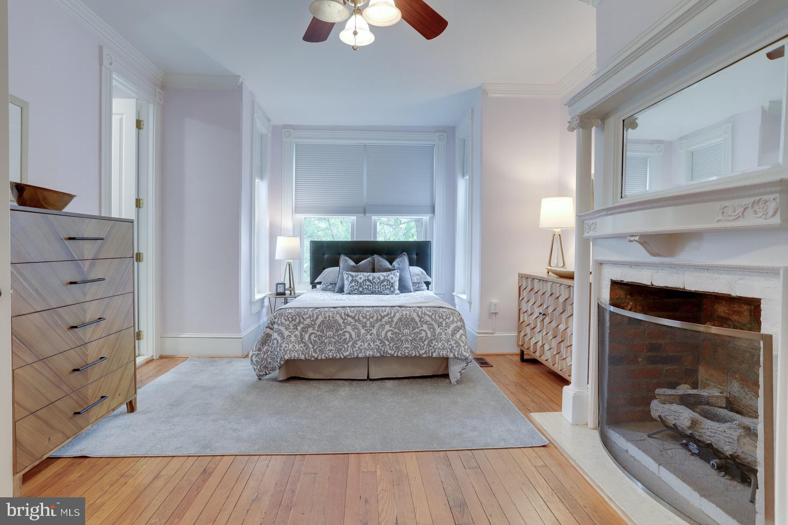 711 Massachusetts Avenue Northeast Washington, DC 20002 - Photo 26 of 68 Large primary bedroom features a fireplace