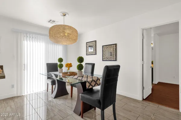 a dining room with furniture and window