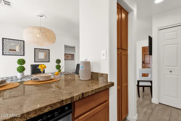a view of living room with granite countertop furniture and wooden floor