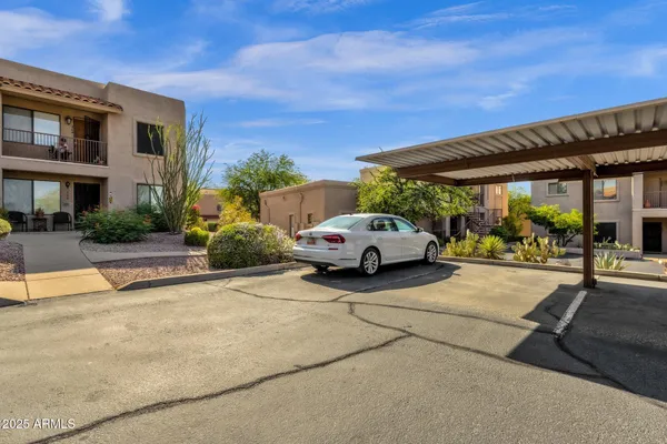 a view of a cars park in front of house