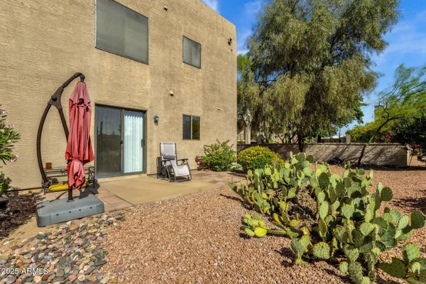 a view of a backyard with a patio