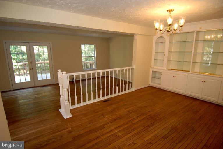 1489 Autumn Ridge Circle Reston, VA 20194 - Photo 13 of 23 a view of a livingroom with wooden floor and windows