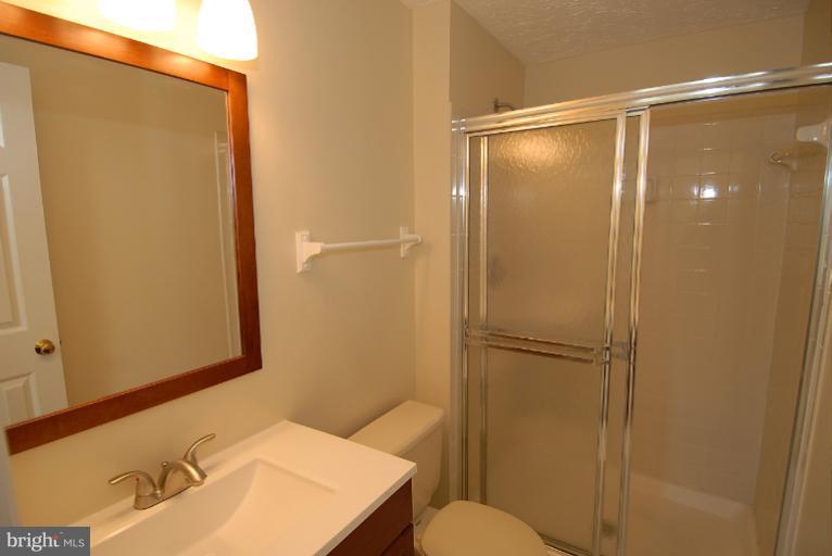1489 Autumn Ridge Circle Reston, VA 20194 - Photo 5 of 23 a bathroom with a shower and a sink