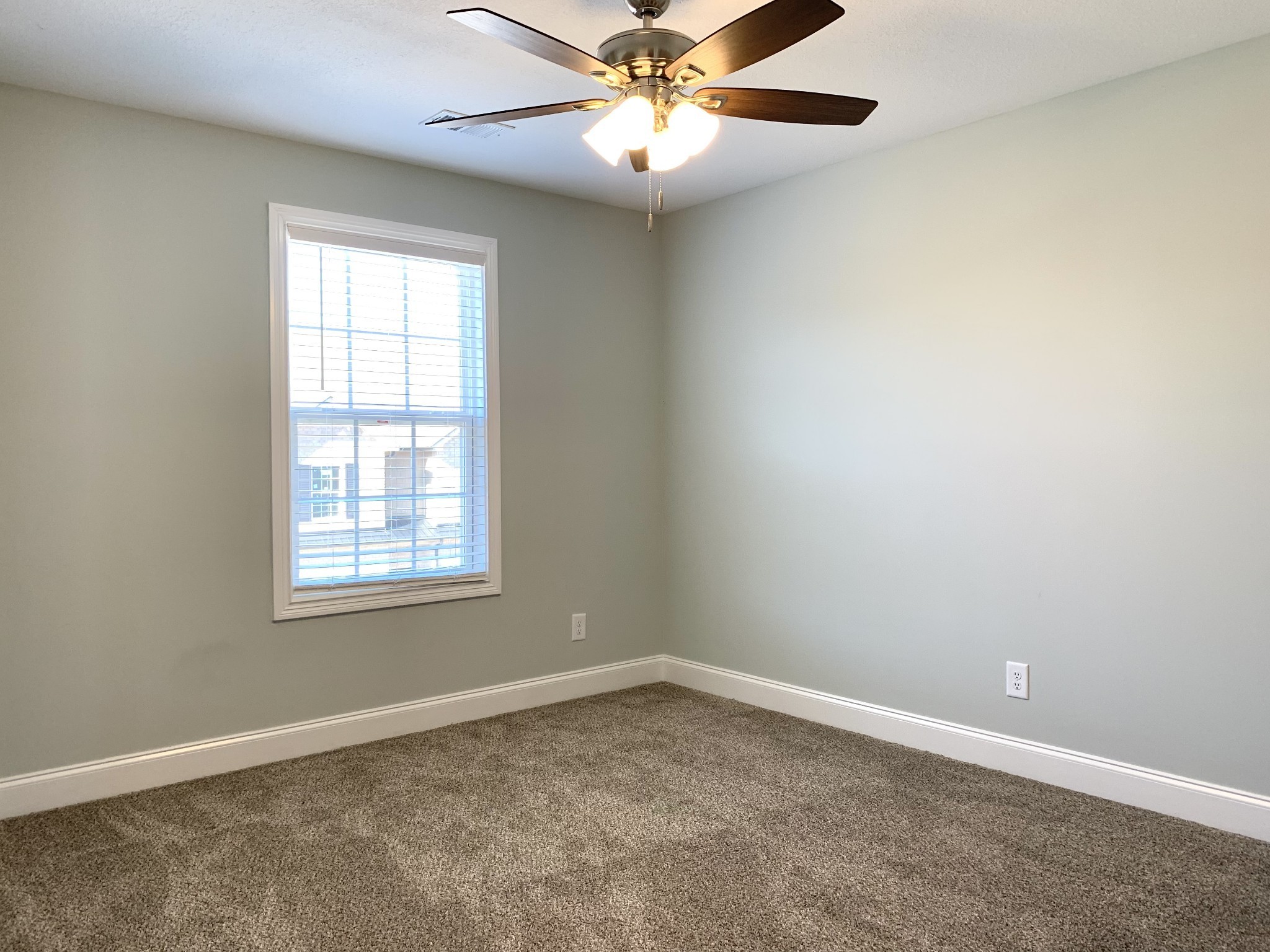 915 Sinclair Drive, Unit 103 Clarksville, TN 37042 - Photo 24 of 31 an empty room with a window and a fan