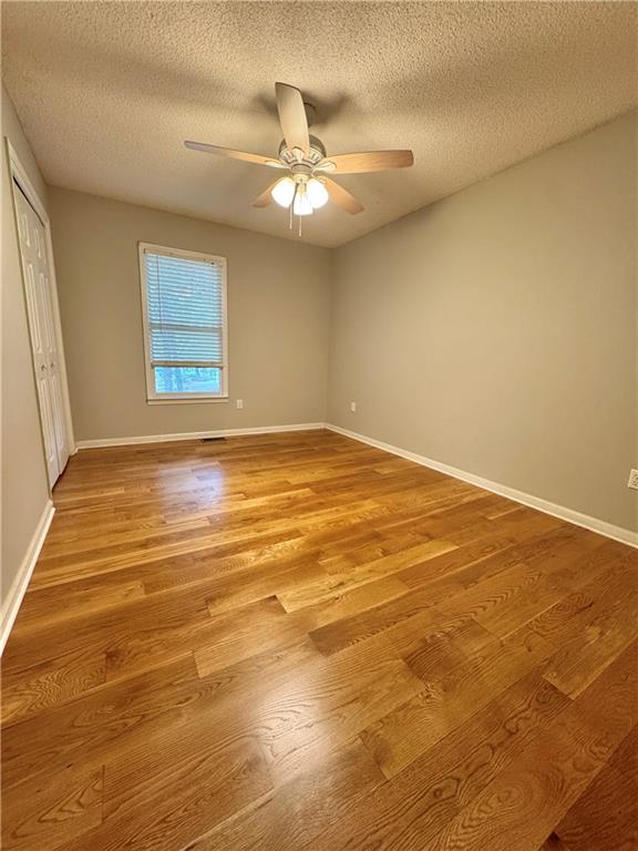 71 Emerald Lane Jasper, GA 30143 - Photo 12 of 30 a view of an empty room with wooden floor