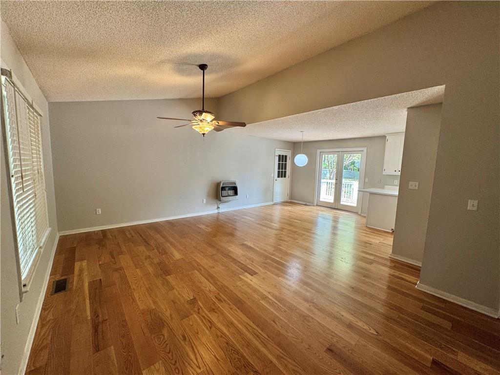 71 Emerald Lane Jasper, GA 30143 - Photo 2 of 30 a view of an empty room with wooden floor and a window