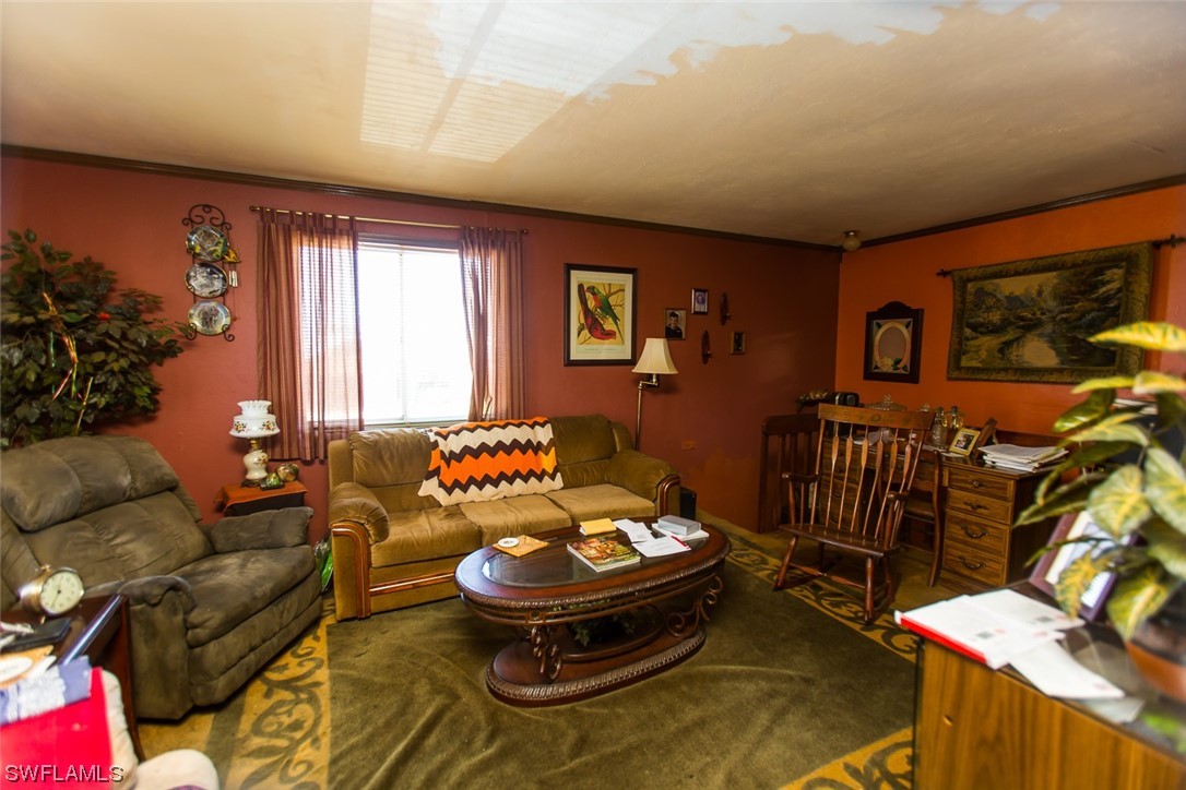 8469 Cardinal Road Fort Myers, FL 33967 - Photo 17 of 44 a living room with furniture and a large window