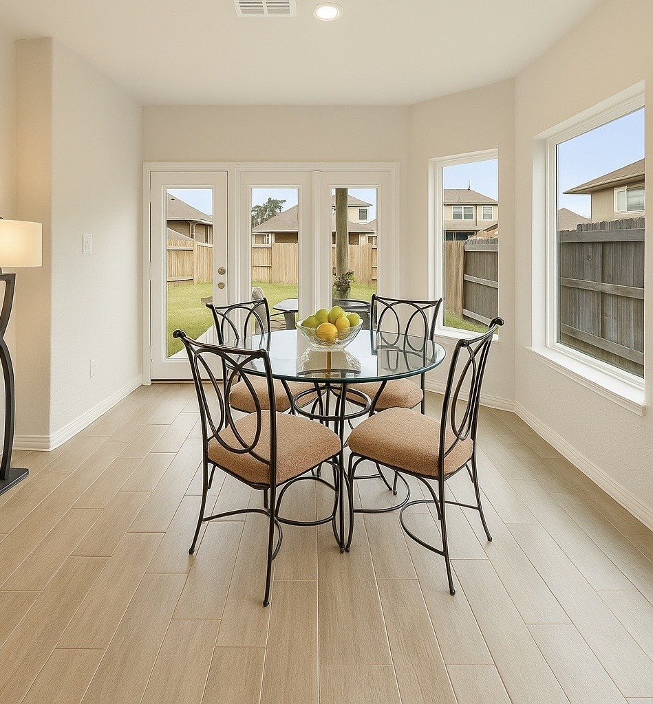 1711 Country Air Lane Missouri City, TX 77459 - Photo 11 of 29 a view of a dining room with furniture and wooden floor