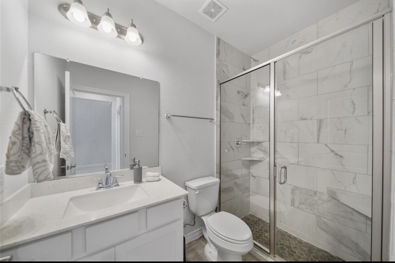 1711 Country Air Lane Missouri City, TX 77459 - Photo 20 of 29 a bathroom with a sink toilet and shower