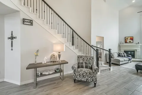a view of entryway and hall with wooden floor
