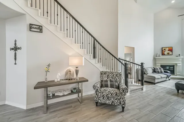 a view of entryway and hall with wooden floor