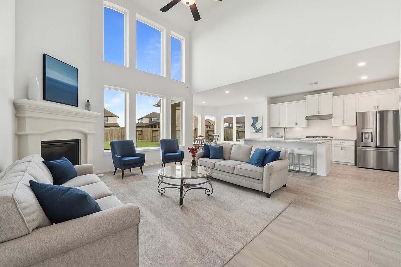 1711 Country Air Lane Missouri City, TX 77459 - Photo 7 of 29 a living room with furniture and a fireplace