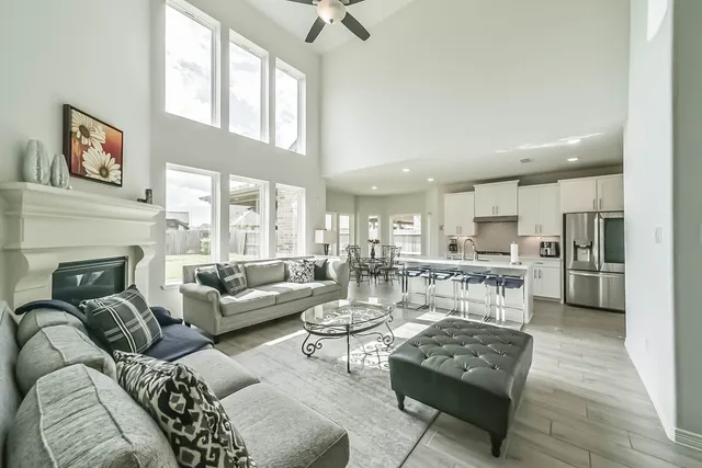 a living room with furniture and a fireplace