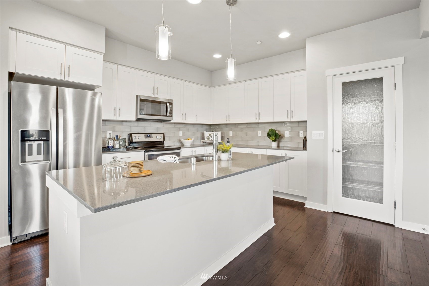1325 Seattle Hill Road, Unit F1 Bothell, WA 98012 - Photo 11 of 34 a kitchen with stainless steel appliances granite countertop a sink refrigerator and cabinets