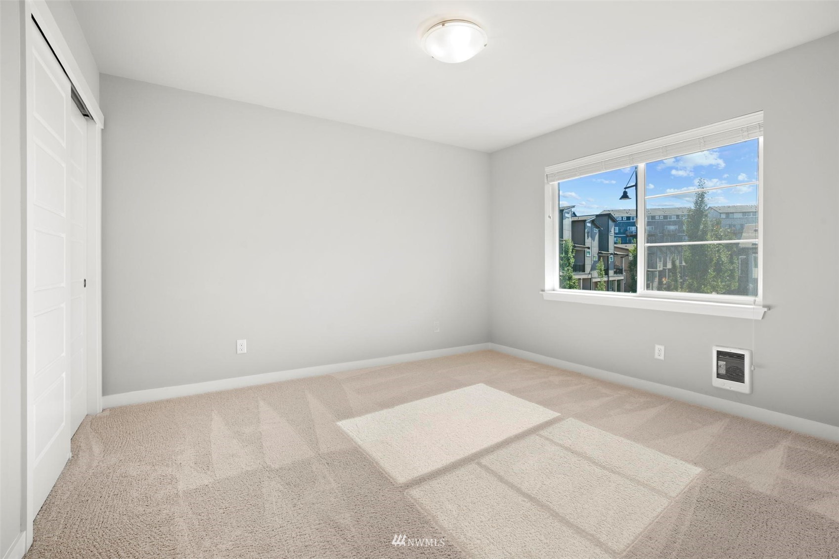 1325 Seattle Hill Road, Unit F1 Bothell, WA 98012 - Photo 18 of 34 a view of an empty room with a window