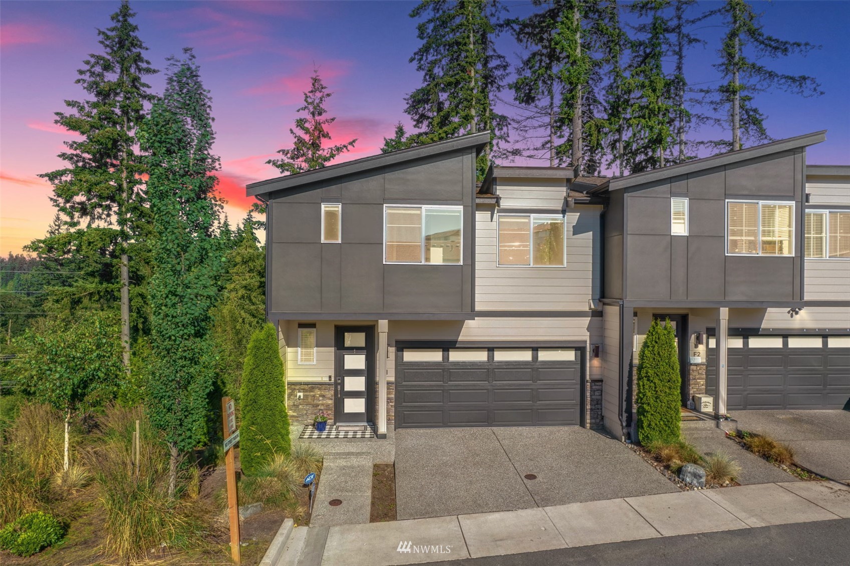 1325 Seattle Hill Road, Unit F1 Bothell, WA 98012 - Photo 2 of 34 a front view of a house with garden