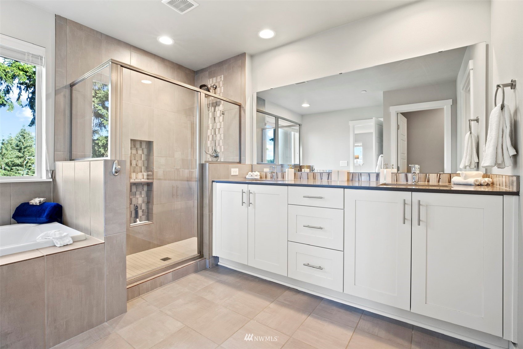 1325 Seattle Hill Road, Unit F1 Bothell, WA 98012 - Photo 24 of 34 a bathroom with a granite countertop sink mirror and shower