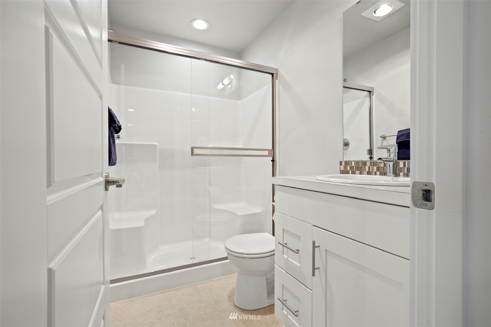 1325 Seattle Hill Road, Unit F1 Bothell, WA 98012 - Photo 29 of 34 a bathroom with a sink a toilet and shower