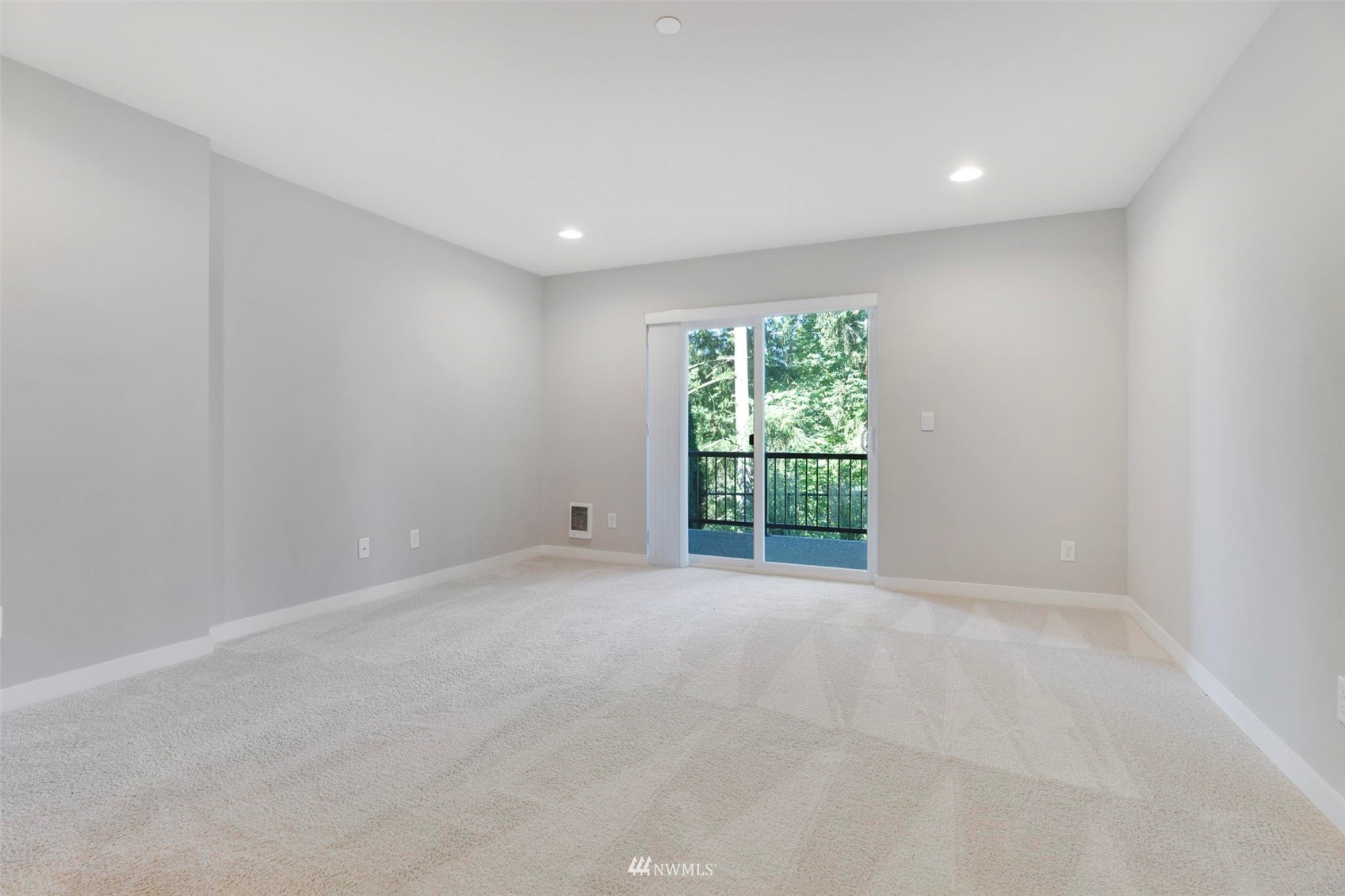 1325 Seattle Hill Road, Unit F1 Bothell, WA 98012 - Photo 32 of 34 a view of an empty room with wooden floor and a window