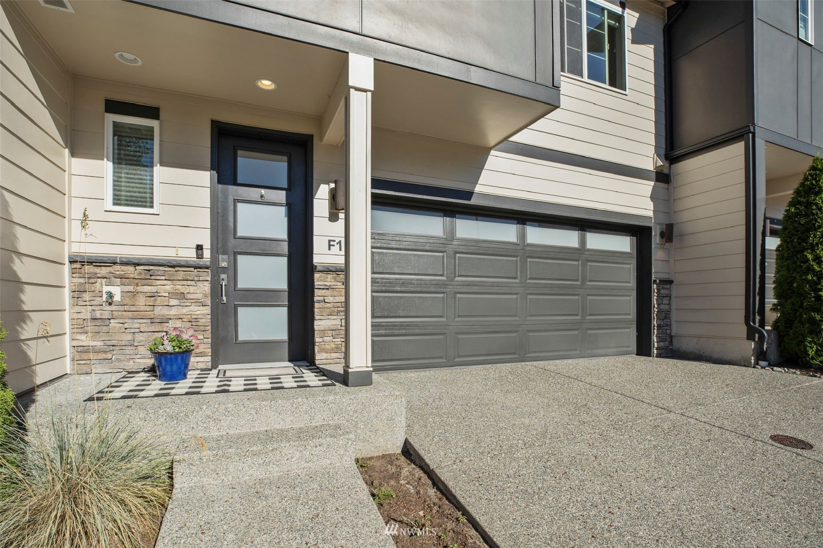 1325 Seattle Hill Road, Unit F1 Bothell, WA 98012 - Photo 4 of 34 a view of a house with a garage