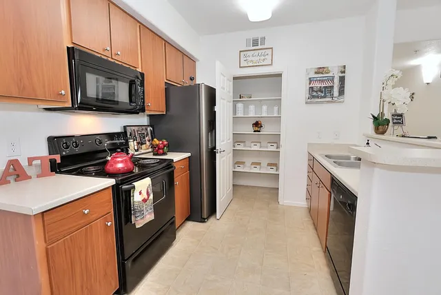 a shelf with cup and plates