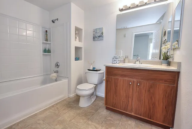 a bathroom with a bathtub and shower