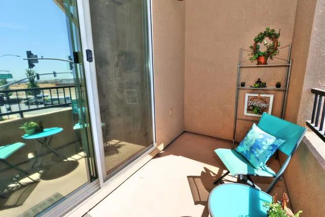 a front view of a multi story residential apartment building with a yard