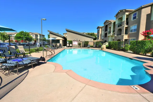 a view of a swimming pool with a garden