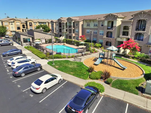an aerial view of a houses with yard