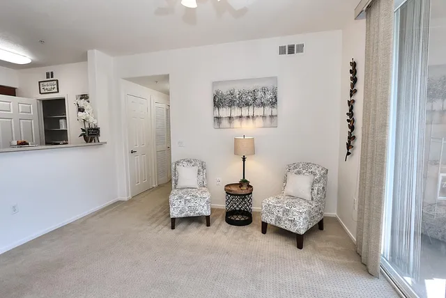 a living room with furniture and a window