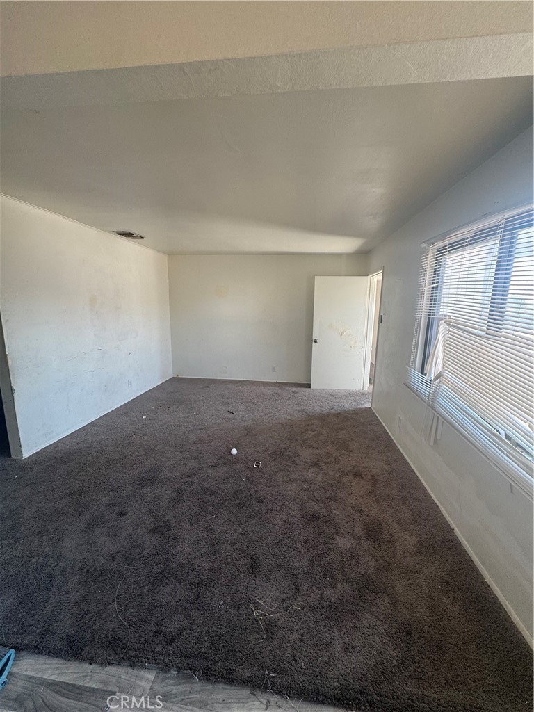 1901 Sunrise Road Barstow, CA 92311 - Photo 2 of 10 an empty room with windows