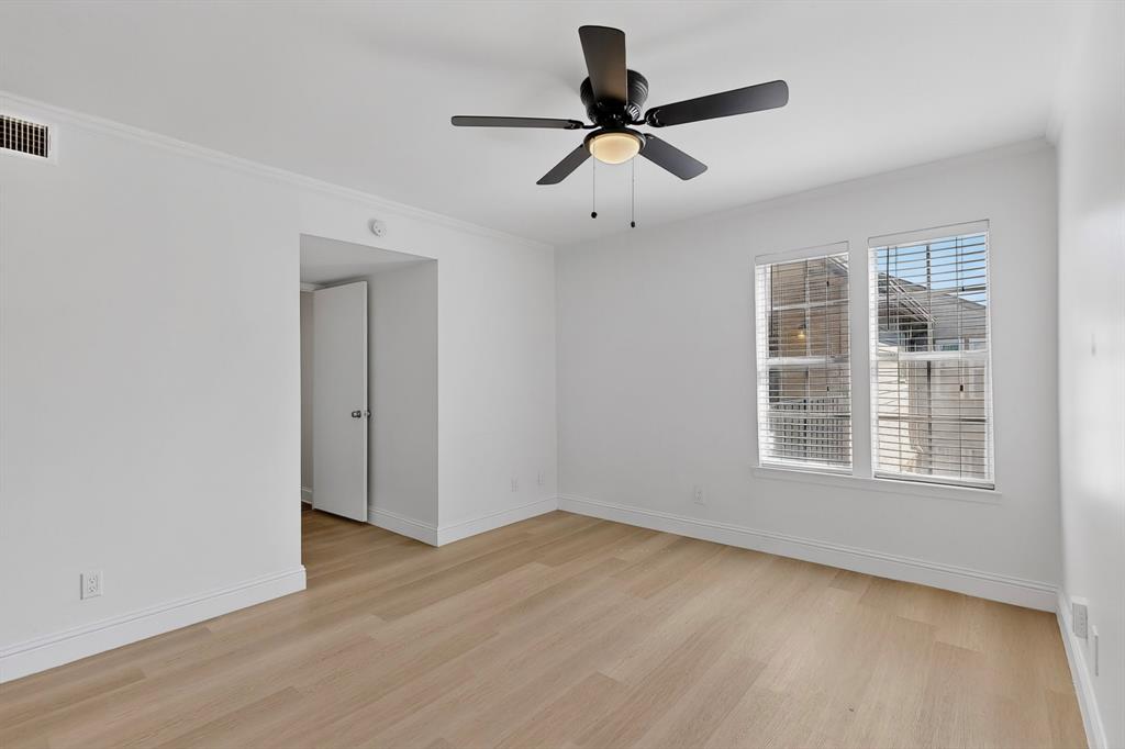 5300 Keller Springs Road, Unit 2062 Dallas, TX 75248 - Photo 20 of 27 wooden floor in an empty room with a window