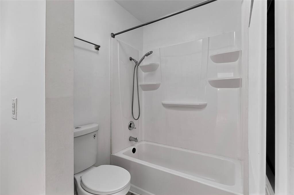 5300 Keller Springs Road, Unit 2062 Dallas, TX 75248 - Photo 21 of 27 a bathroom with a toilet and a shower