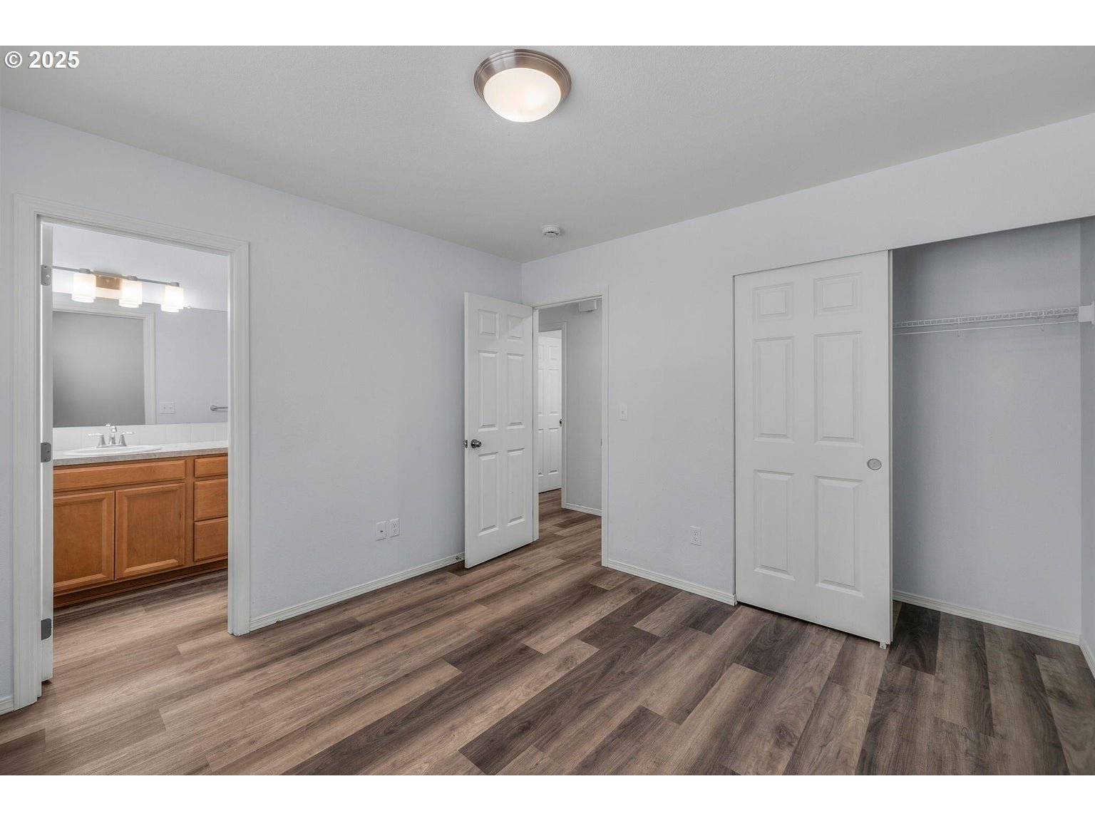 11421 Burlwood Road La Pine, OR 97739 - Photo 11 of 31 a view of an empty room and wooden floor