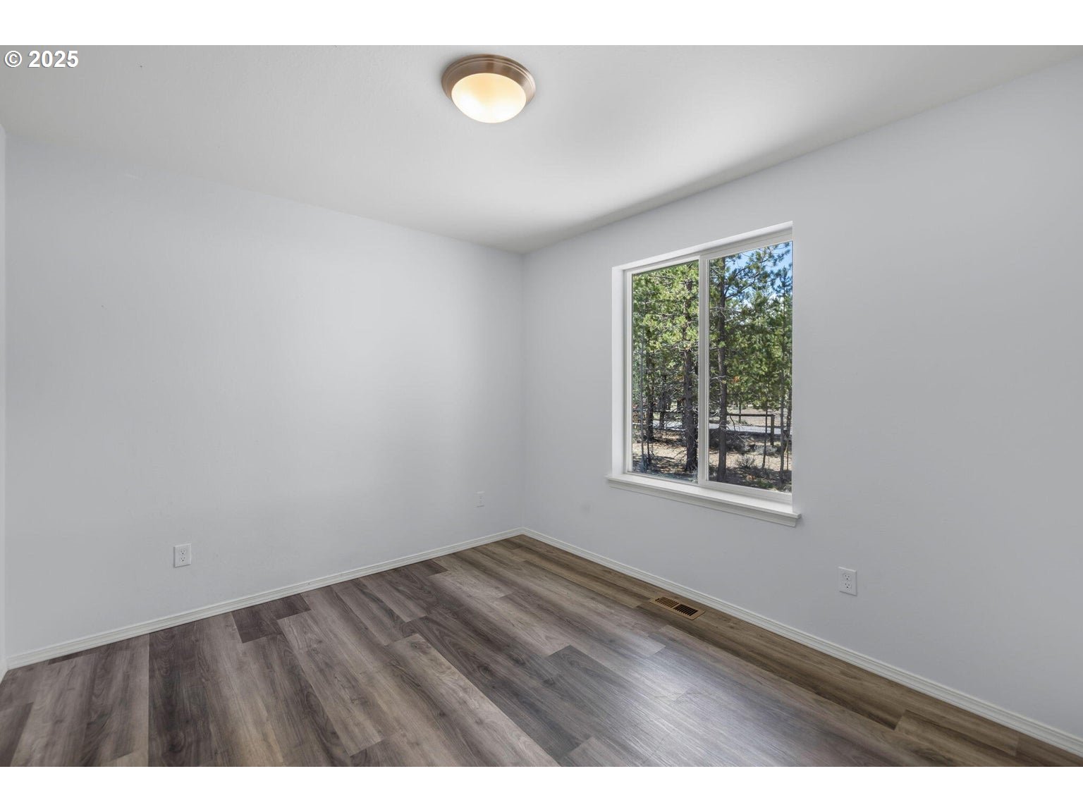 11421 Burlwood Road La Pine, OR 97739 - Photo 14 of 31 a view of an empty room with a window