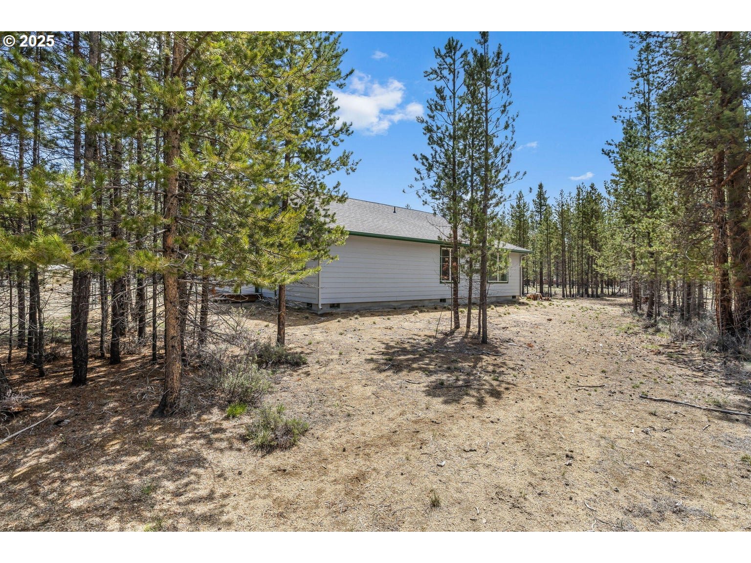 11421 Burlwood Road La Pine, OR 97739 - Photo 27 of 31 a backyard of a house with lots of green space