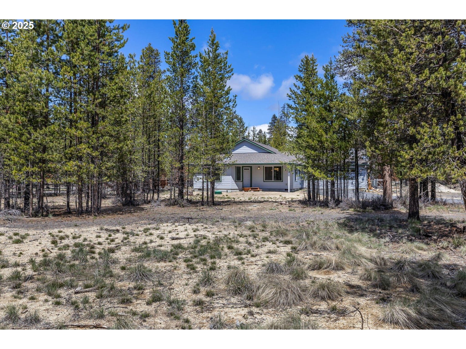 11421 Burlwood Road La Pine, OR 97739 - Photo 30 of 31 a front view of a house with a garden