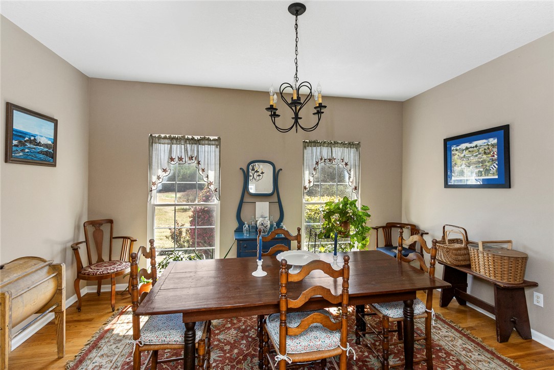 108 Pearman Drive Pendleton, SC 29670 - Photo 15 of 50 This dining room offers hardwood flooring, ample natural light, and a charming chandelier.