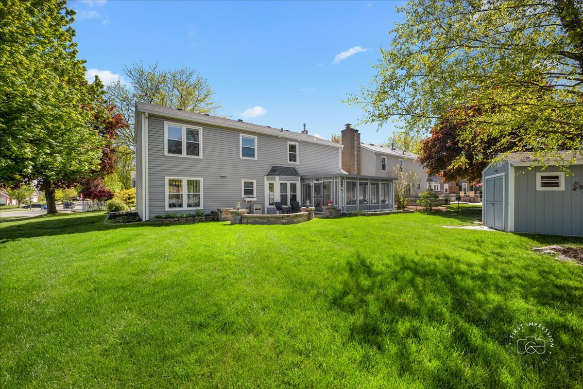 375 Hunter Drive Carol Stream, IL 60188 - Photo 3 of 20 a view of a house with a big yard with large tree