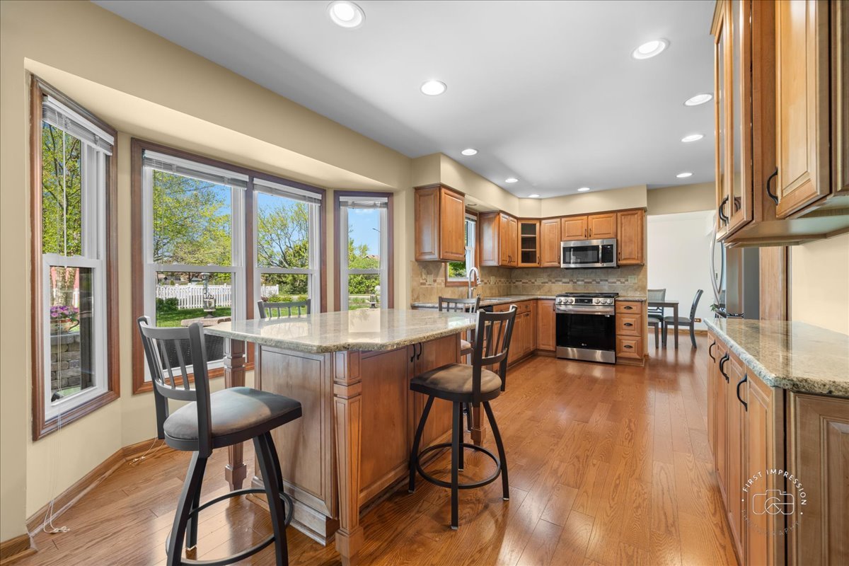 375 Hunter Drive Carol Stream, IL 60188 - Photo 5 of 20 a view of a dining room with furniture window and wooden floor