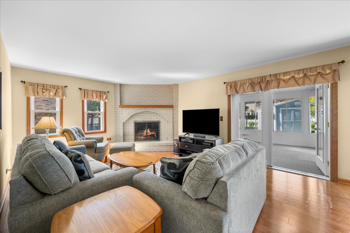 375 Hunter Drive Carol Stream, IL 60188 - Photo 8 of 20 a living room with furniture and a flat screen tv