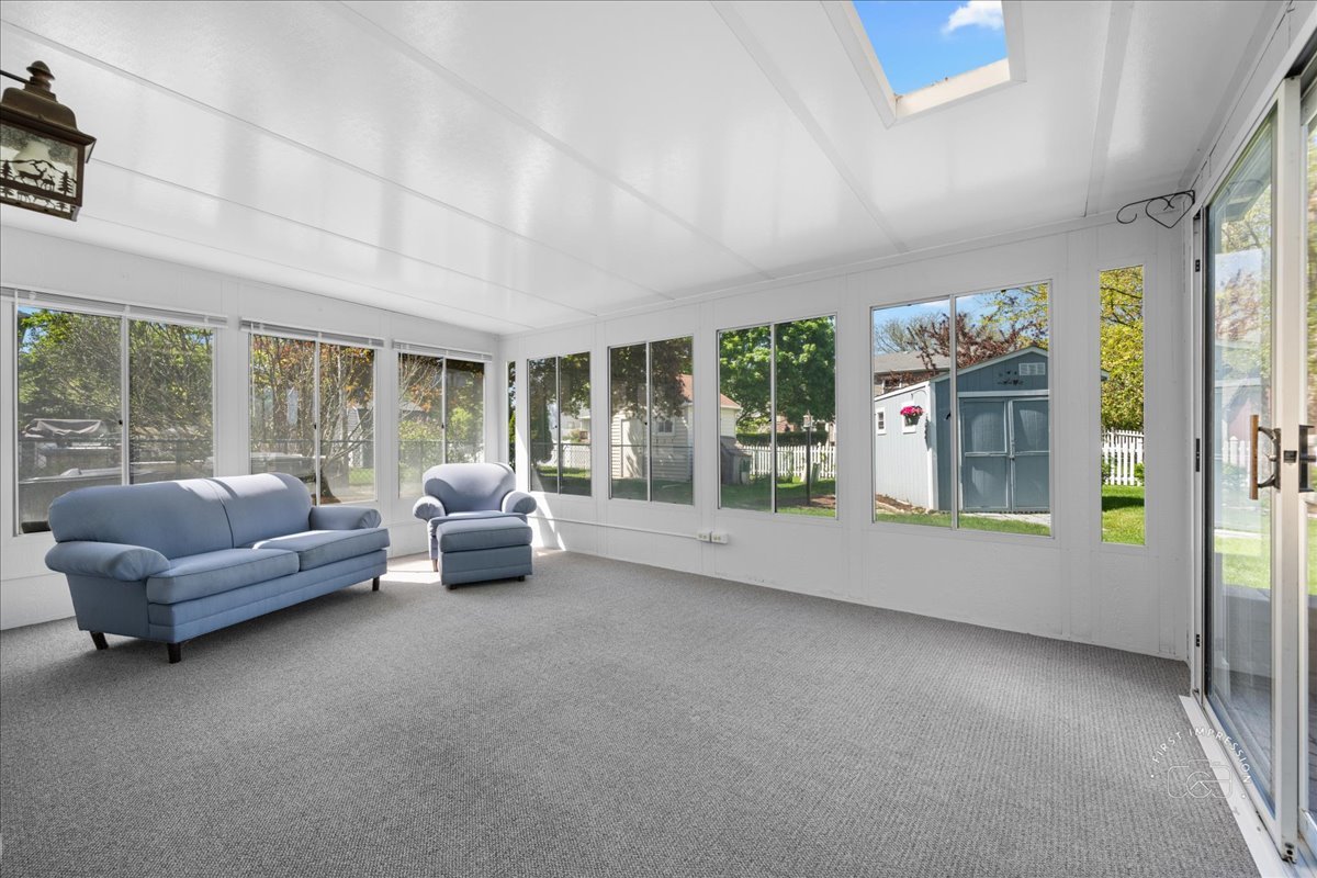 375 Hunter Drive Carol Stream, IL 60188 - Photo 9 of 20 a living room with furniture and large windows