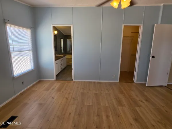 a view of a room with wooden walls