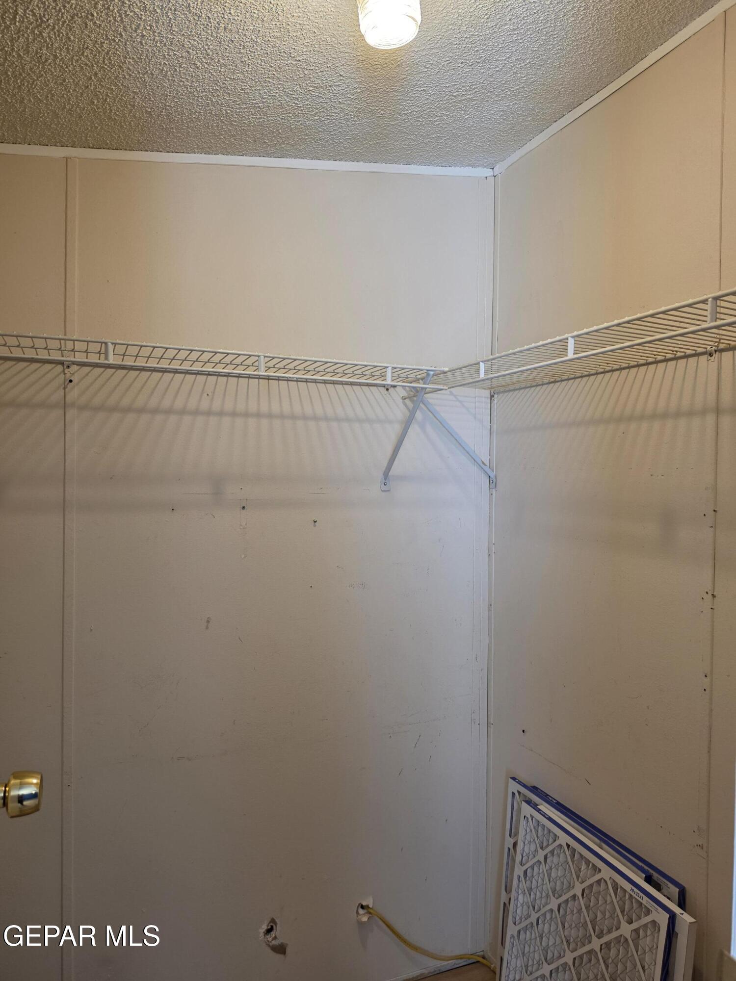 101 Clydesdale Road Dell City, TX 79847 - Photo 53 of 90 a view of a room with racks on the wall