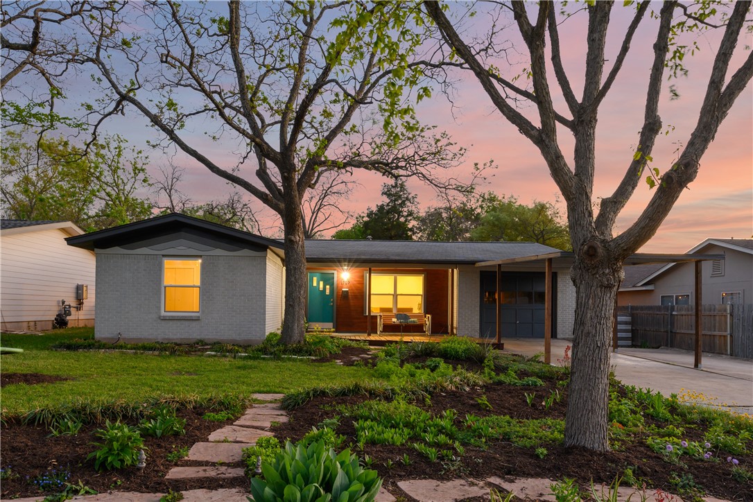1707 Barbara Street Austin, TX 78757 - Photo 1 of 1 a front view of house with a garden