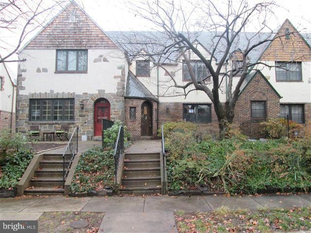 3711 Rexmere Road Baltimore, MD 21218 - Photo 1 of 23 a front view of a house with a garden