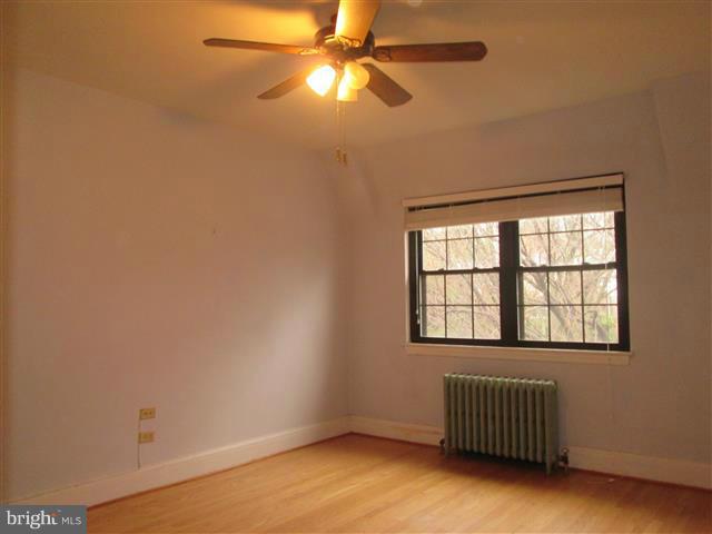 3711 Rexmere Road Baltimore, MD 21218 - Photo 14 of 23 an empty room with a window and a ceiling fan